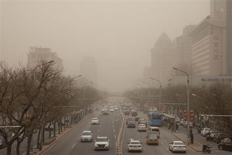 Yellow Smog Envelops Beijing Amid Severe Sandstorms In Northern China