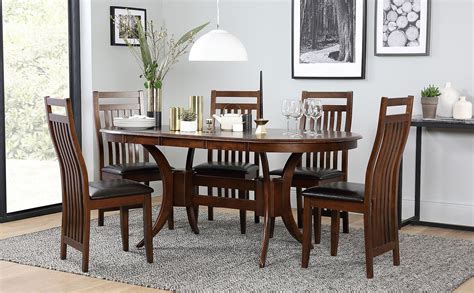 Sold and shipped by spreetail. Townhouse Oval Dark Wood Extending Dining Table with 6 Java Chairs (Brown Leather Seat Pads ...