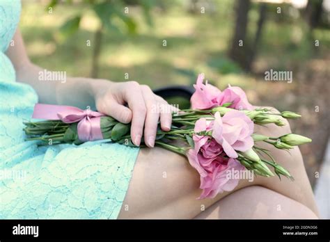 Woman Holding Beautiful Bouquet Of Eustoma Flowers Outdoors Stock