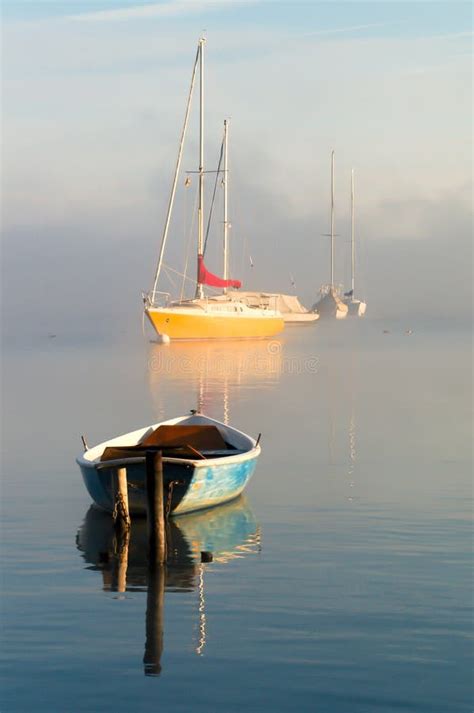 Boats At The Lake In Misty Morning Dawn Stock Photo Image Of Water