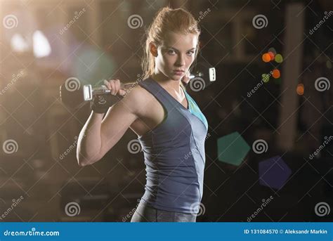 Young Woman Lifting The Dumbbells Stock Photo Image Of Equipment