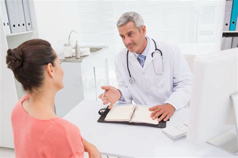 Patient Consulting A Happy Doctor Stock Photo Image Of Male