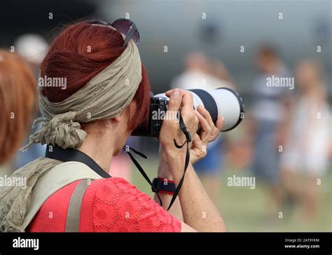Professional Woman Photographer In Action Stock Photo Alamy