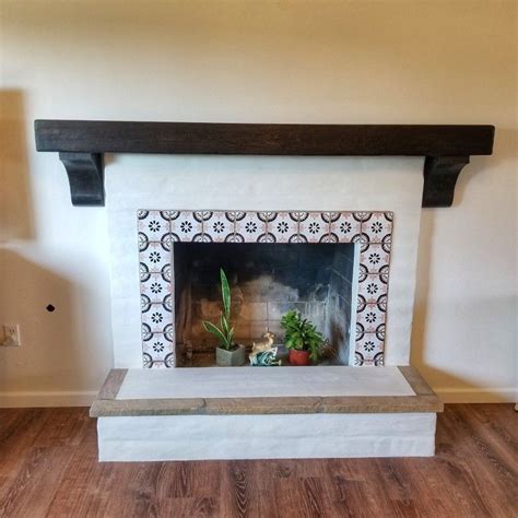 Fireplace With Spanish Tile Surround And Newly Installed Wood Mantel