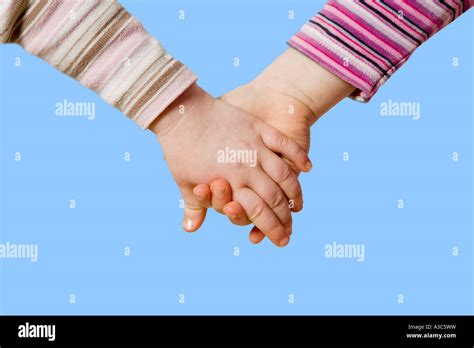 Small Children Holding Hands Girls Stock Photo Alamy