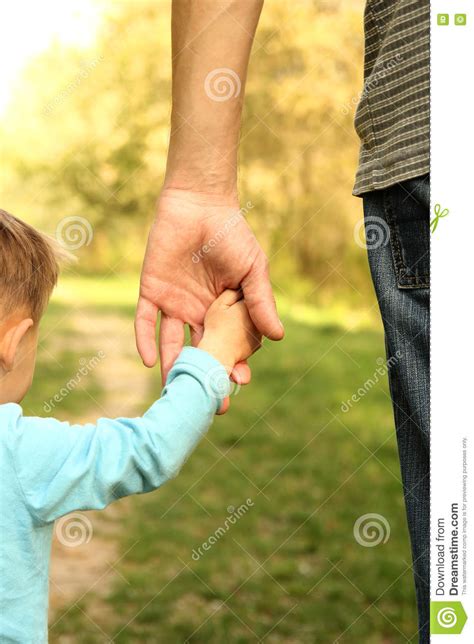 Parent Holds The Hand Of A Small Child Stock Image Image Of Arms