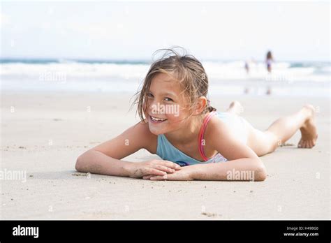 Girl Lies On The Beach Stock Photo Alamy
