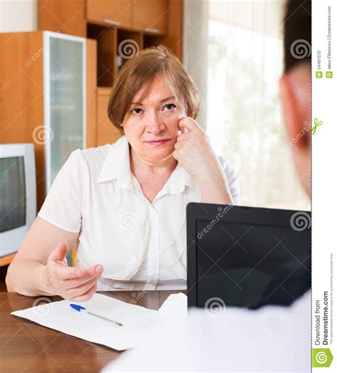 Mature Woman Answer Questions Of Worker Stock Photo Image