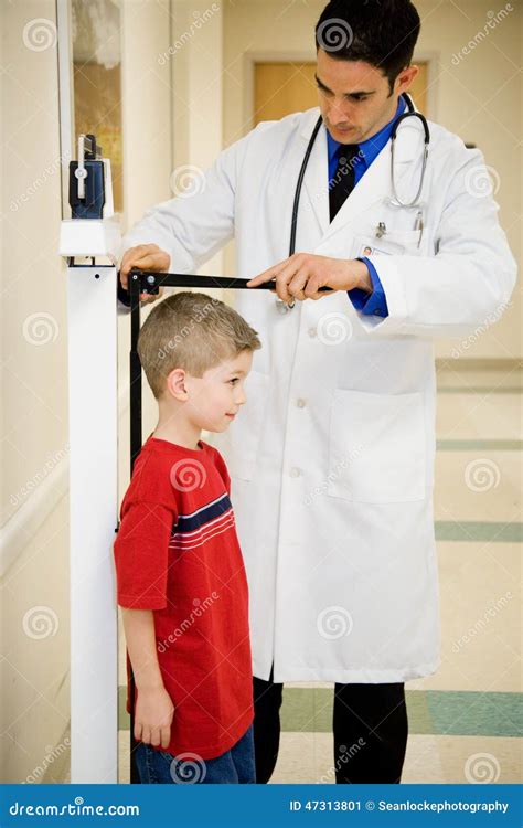 Hospital Boy Stands Still To Have Height Measured Stock Image Image