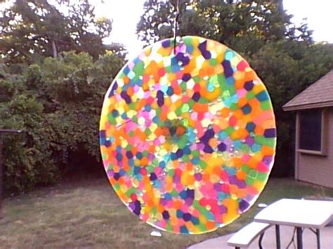 Suncatcher Made By Melting Plastic Beads In Cake Pan On Grill