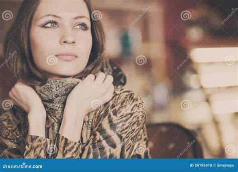 A Young Beautiful Girl Waiting For A Cup Of Tea In A Cafe Stock Photo
