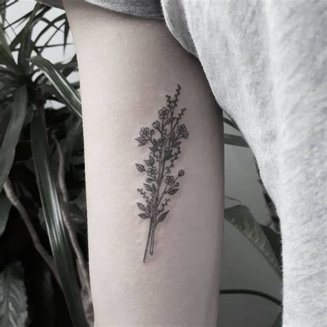 minimalist-floral-bouquet-tattoo-inked-on-the-right-arm-bouquet-tattoo,-minimalist-tattoo