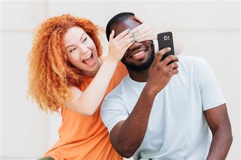 Free Photo Couple Being Playful While Taking A Selfie
