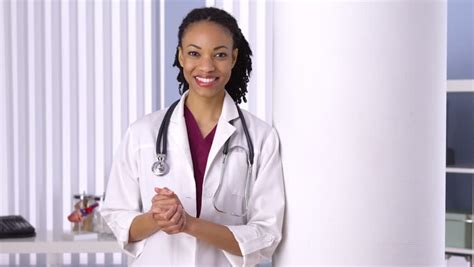 Female African American Doctor Holding Medical Chart Stock Footage