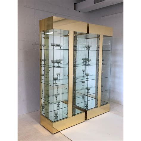 Pair Of Lighted Brass And Glass Curios Display Cabinets Chairish