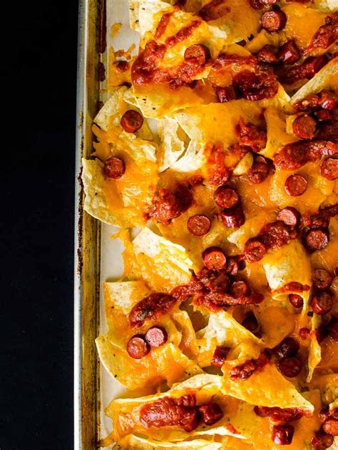 Layer chips, pizza sauce, cheese sauce, pepperonis and shredded cheese in the baking dish/sheet. Pizza Nachos | Pizza nachos, Nachos recipe, Pizza nachos ...