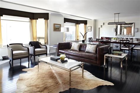 Masculine Living Room With Cowhide Rug Dark Brown Leather Sofa And
