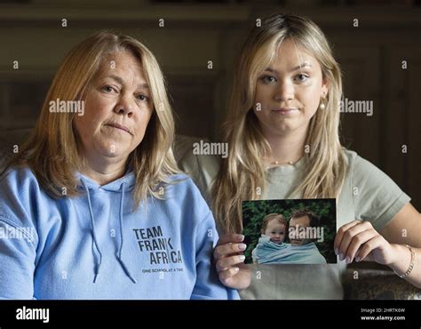Kimmy Chedel Left And Daughter Zoe Doyle Pose With A Photograph Of Their Husbandfather Frank