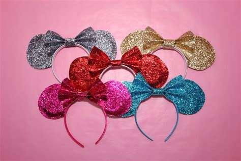 The higher quality glue used in a hot glue gun will create a better bond between the flap of the ear and the base of the band. Easy to Make Minnie Mouse Headband DIY for less than $5