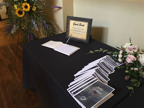Classic Set Up For A Guest Book And Program Table For A Celebration Of
