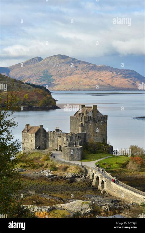 Eilean Donan Castle With Autumnal Forest Headquarters Of The Scottish