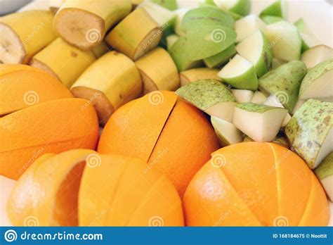 Banana Pear And Apple Pieces With Orange Slices In A Closeup Stock