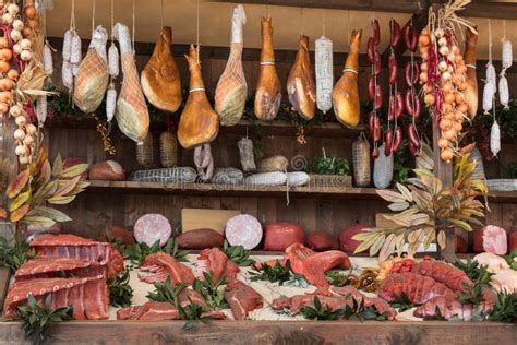 Meat Assortment And Sausages In Butcher Shop On Wooden Board Stock