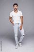 Handsome man wearing jeans and white t-shirt Stock 写真 | Adobe Stock
