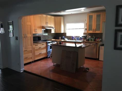 Lower corner kitchen cabinets have more depth and storage space, but this often goes wasted due to poor accessibility. Modern Kitchen Makeover - Teal Blue Cabinets | Apartment ...