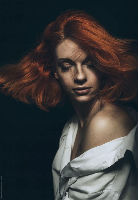 Portrait Of Beautiful Ginger Woman With Hair In Motion By Stocksy Contributor Audshule