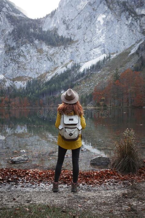 Girl Stands On The Shore Of A Mountain Lake Stock Photo Image Of Peak