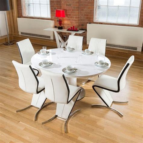 This dining set comes complete with four mink microsuede upholstered chairs. Delightful dining set white gloss round/oval extending ...