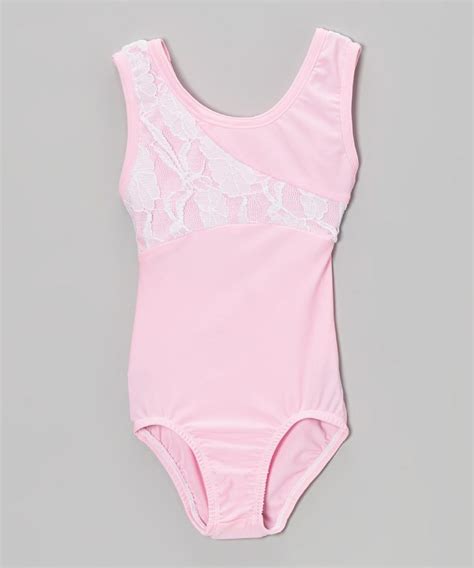 A Pink Bodysuit With White Lace On The Front And Back Sitting Against