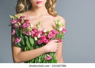 Cropped View Naked Woman Holding Bouquet Stock Photo 1311837386