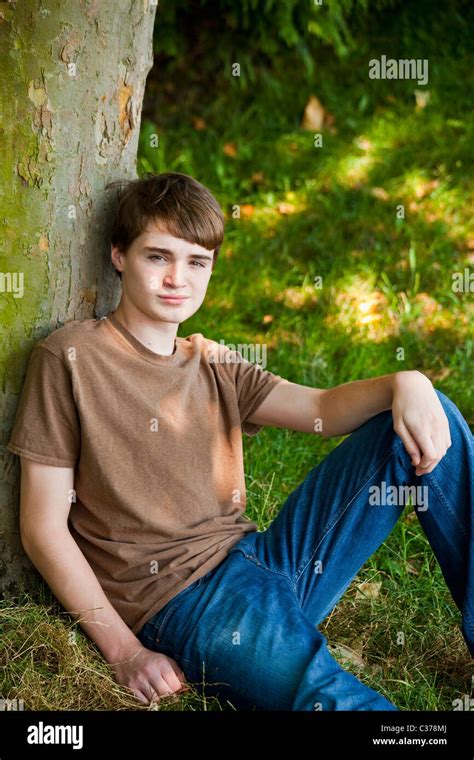 Young Teen Boy Sitting In Park 12 14 Years Old Stock Photo Alamy