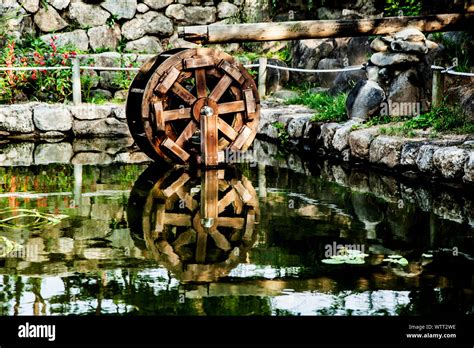 Water Wheel In Pond Stock Photo Alamy