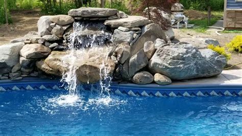 Swimming Pool Waterfall With Natural Rock Youtube