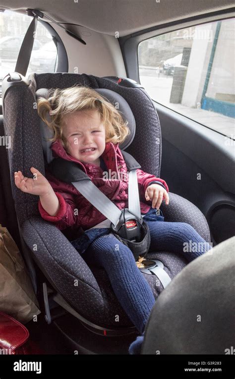 Two Year Old Toddler Crying In Her Car Seat England Uk Stock Photo