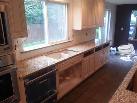 Maybe you would like to learn more about one of these? Santa Cecilia granite countertops with white backsplash ...