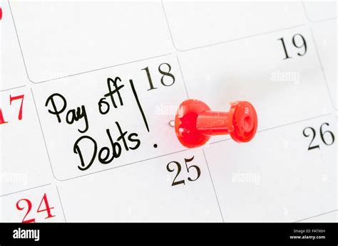The Words Pay Off Debts Written On A Calendar Stock Photo Alamy