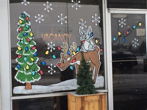 Local Artist Spreads Christmas Cheer With Festive Window Paintings