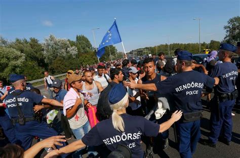 Thousands Of Refugees Begin Walking Along Motorway To Austria After Hungarian Authorities Refuse