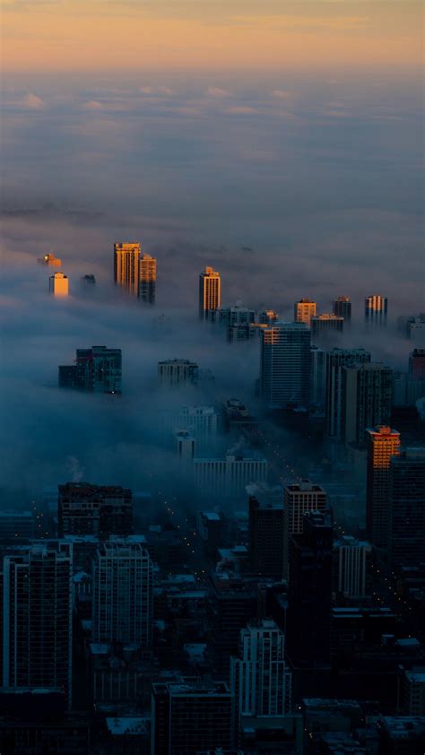 Download Wallpaper 1350x2400 Night City Clouds Aerial View Fog