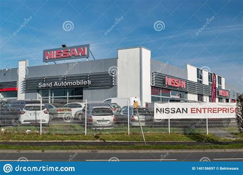 Pay your nissan motor corporation bill online with doxo. View Of The Nissan Brand Dealership Store On A Blue Sky ...