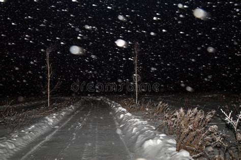 Winter Night Landscape With Road In A Field In The Snow The Snowfall