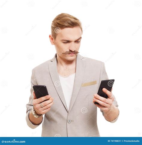 Young Man Holding Two Mobile Phones Make Choice Stock Image Image Of