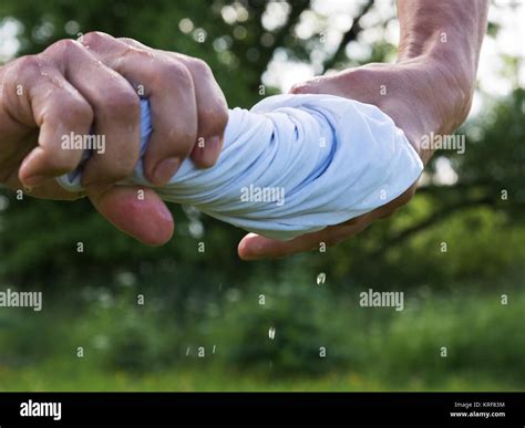 Hands Squeeze Wet Cloth Stock Photo Alamy