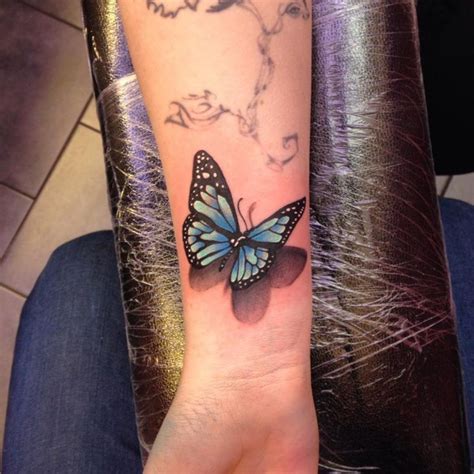 And everything so attractive, from the colors combined inside its body to colors escaping from it. Blue Butterfly Wrist Tattoo | Butterfly wrist tattoo ...
