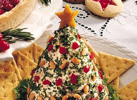 Garnish with chopped red and green bell peppers for extra holiday flare. Holiday Tree-Shaped Cheese Ball recipe | Christmas Recipes