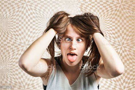 Crosseyed Young Woman Tears Her Hair Tongue Sticking Out On Checked